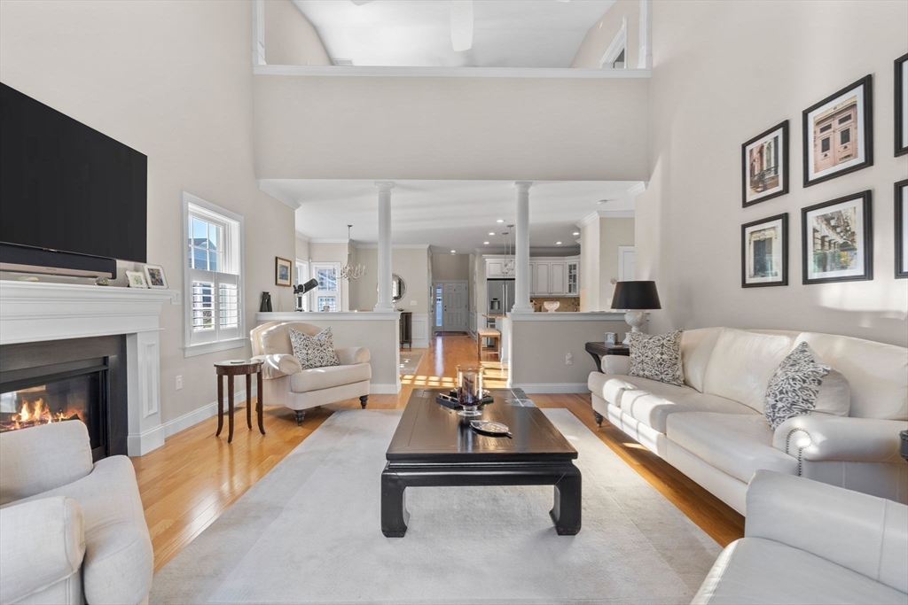 11 Cranberry Lane, Unit 11 Middleton, MA 01949 - Photo 10 of 29 a living room with furniture fireplace and flat screen tv