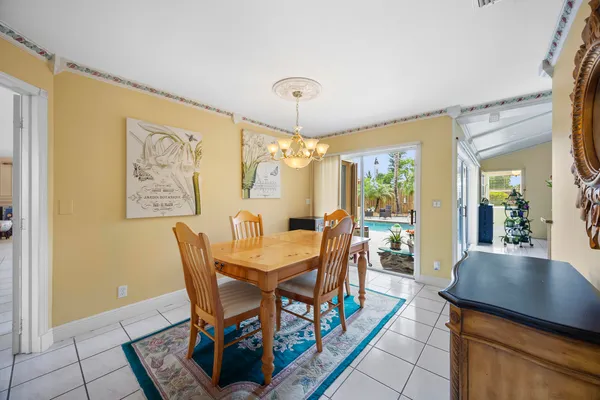 a view of a dining room with furniture and a window