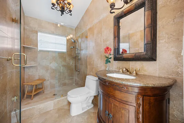 a kitchen with stainless steel appliances granite countertop a stove and a refrigerator