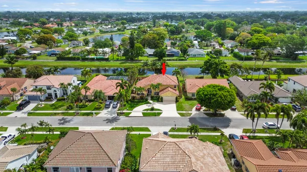a view of backyard with swimming pool and outdoor seating