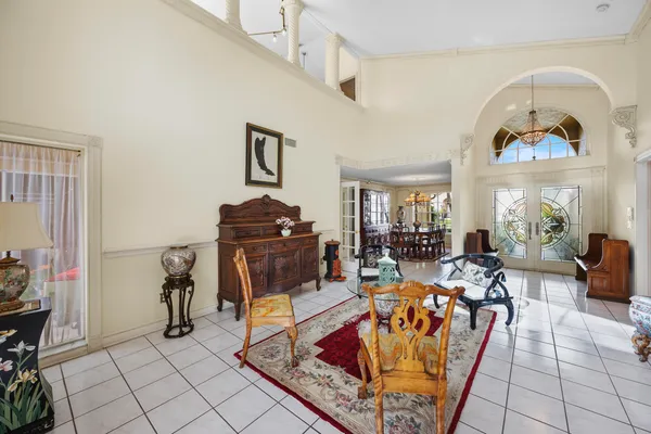 a dining room with furniture and window
