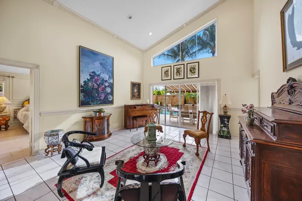 a dining room with furniture and window