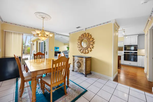 a kitchen with stainless steel appliances granite countertop sink stove and refrigerator