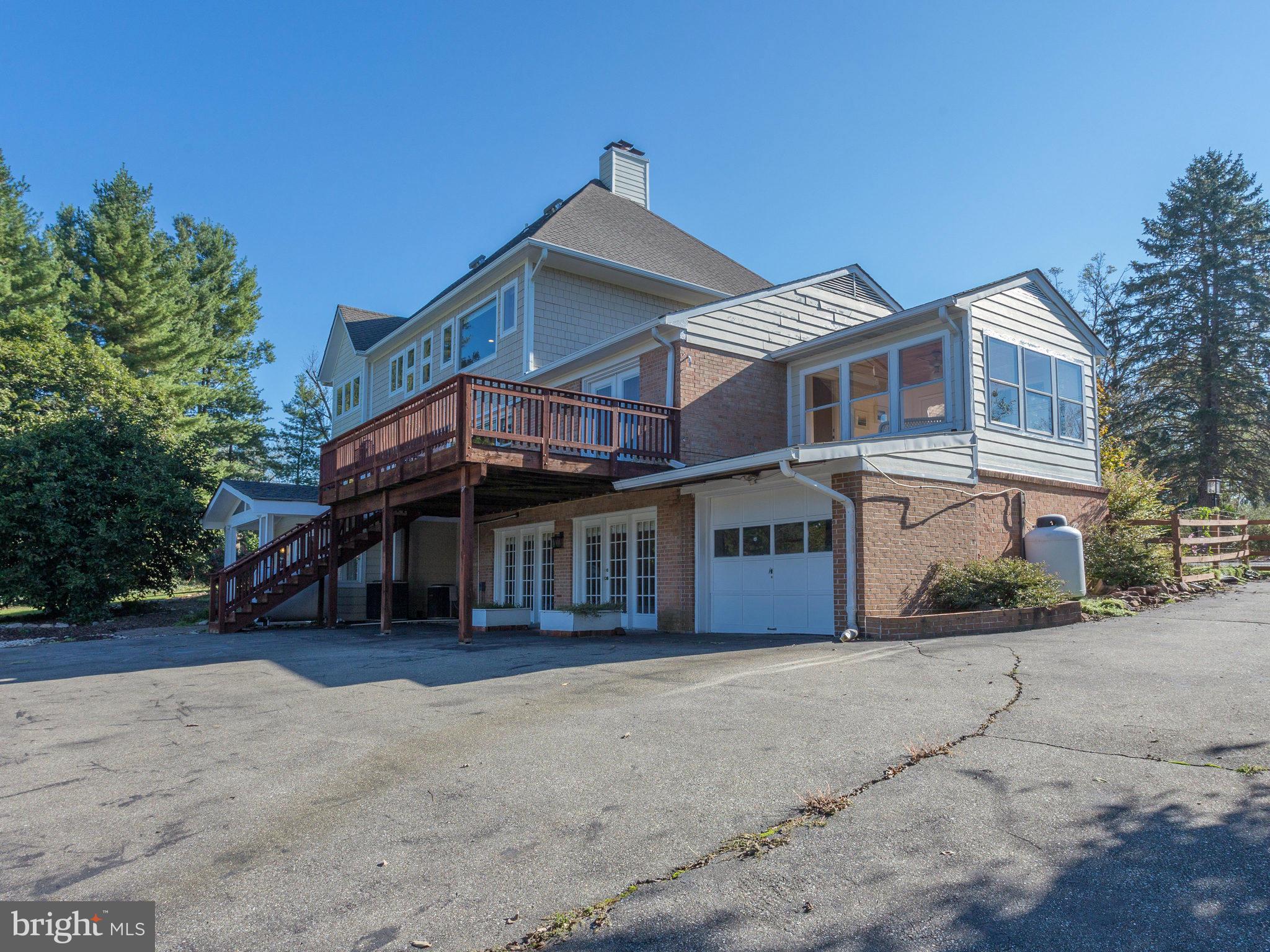 20473 Gleedsville Road Leesburg, VA 20175 - Photo 2 of 30 a front view of a house with a yard and garage