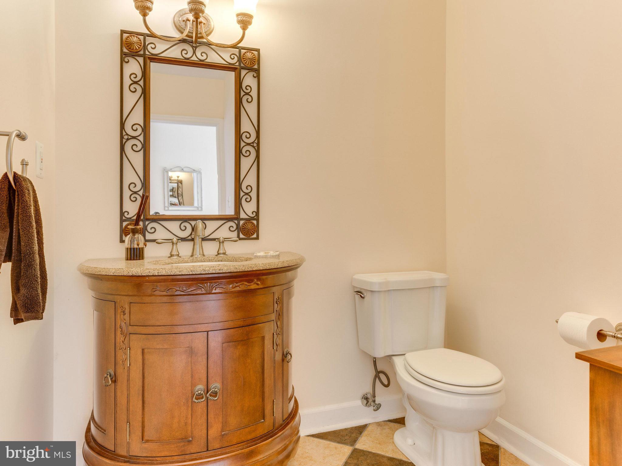 20473 Gleedsville Road Leesburg, VA 20175 - Photo 19 of 30 a bathroom with a toilet a sink and mirror