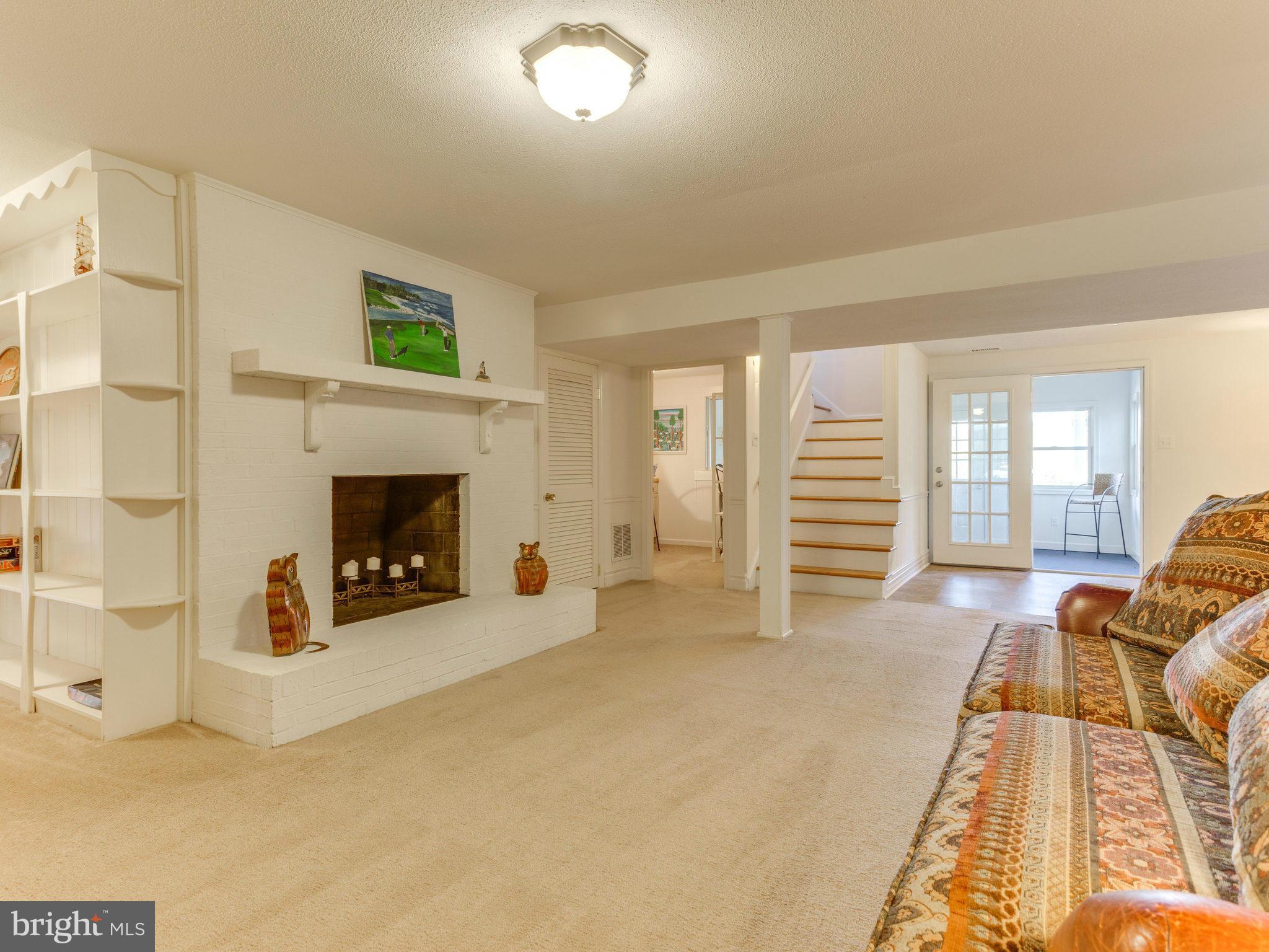 20473 Gleedsville Road Leesburg, VA 20175 - Photo 20 of 30 a living room with furniture and a fireplace