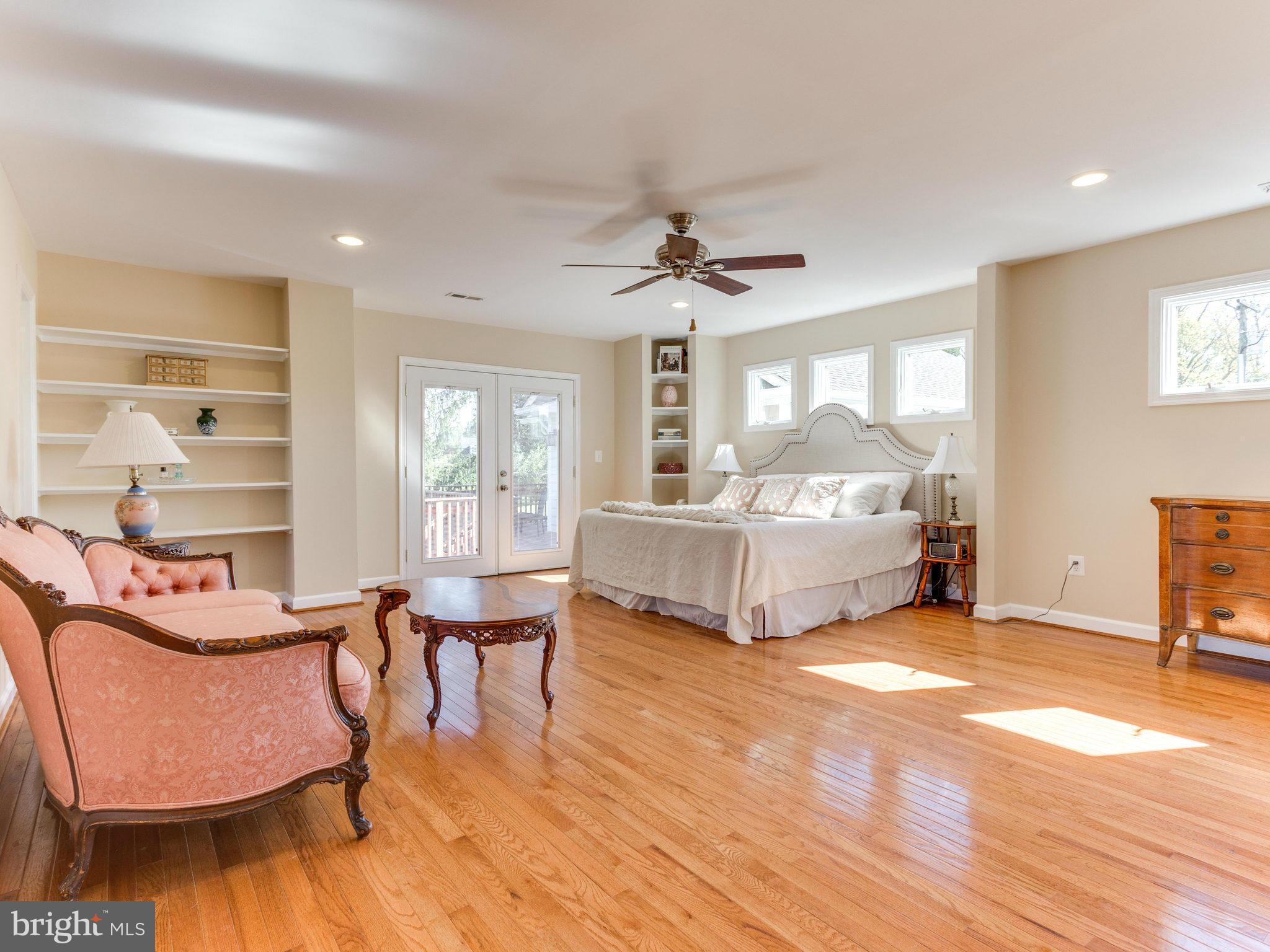 20473 Gleedsville Road Leesburg, VA 20175 - Photo 27 of 30 a spacious bedroom with a bed and a chair