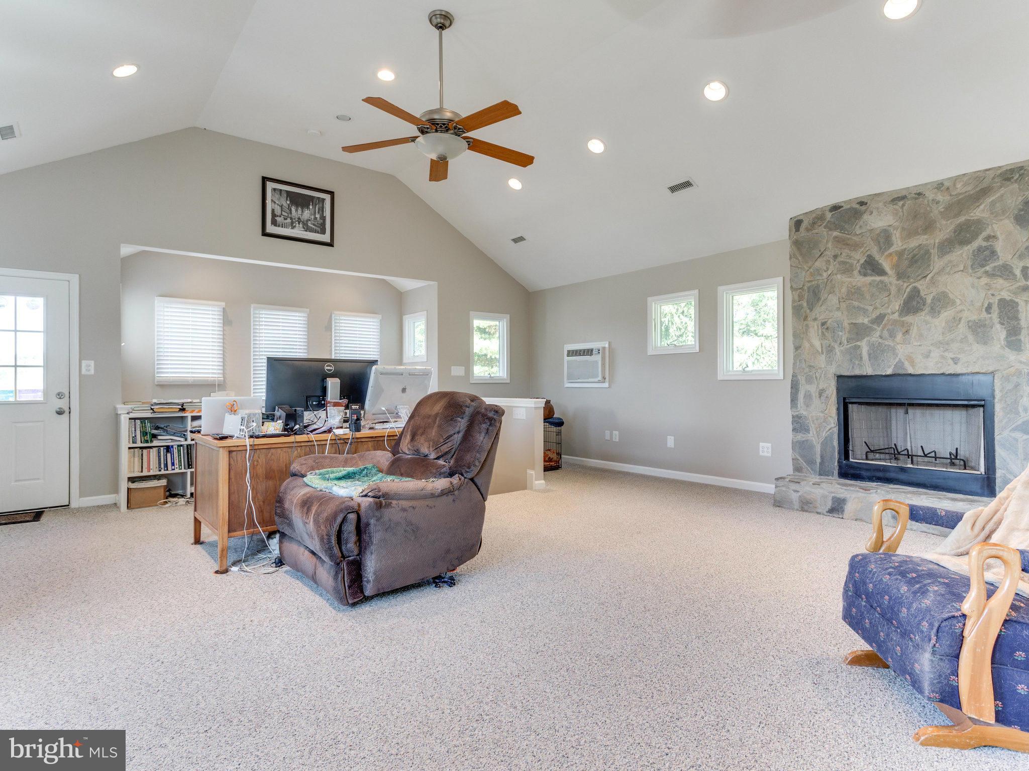 20473 Gleedsville Road Leesburg, VA 20175 - Photo 29 of 30 a living room with furniture and a fireplace