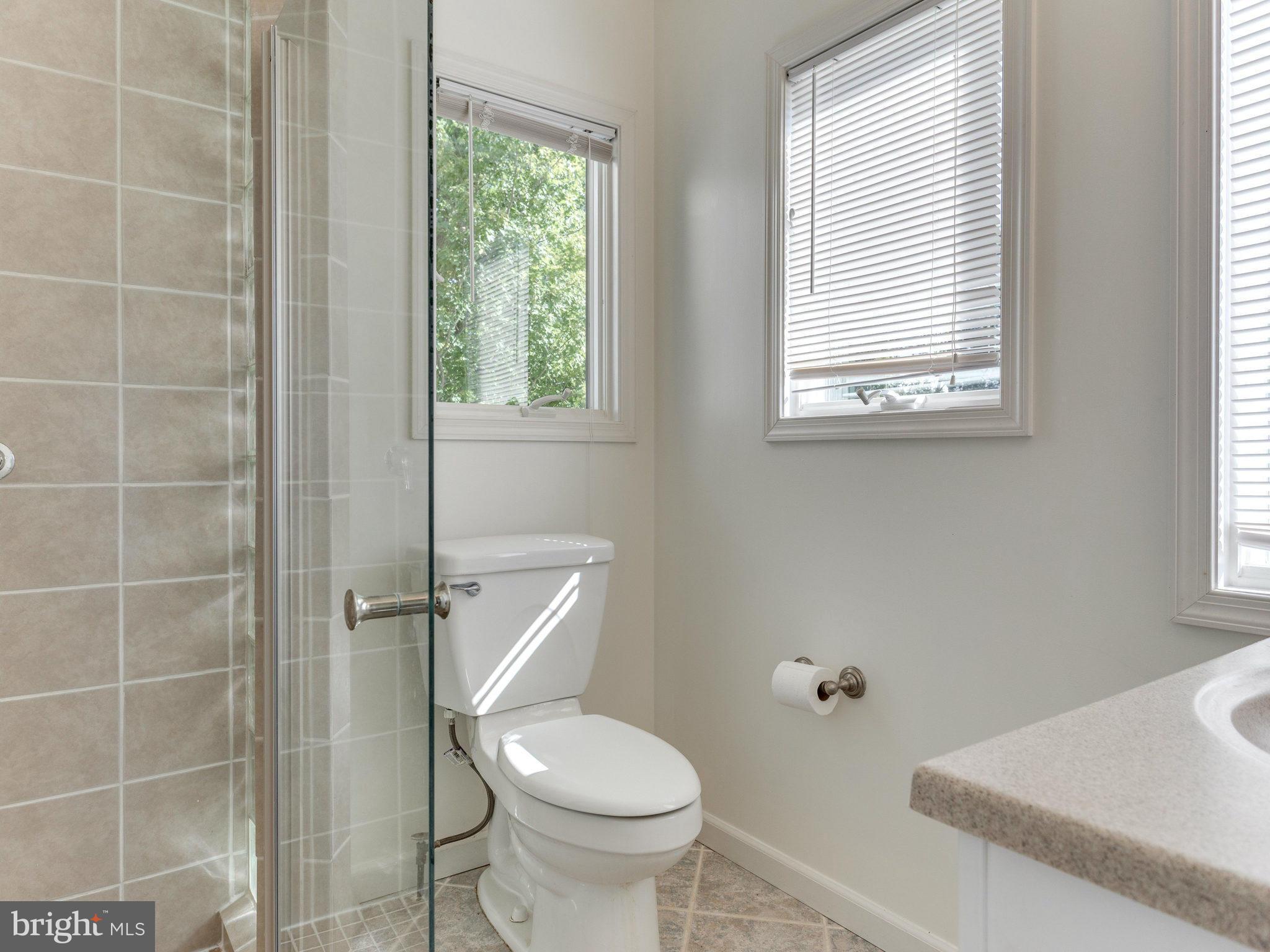 20473 Gleedsville Road Leesburg, VA 20175 - Photo 30 of 30 a white toilet sitting next to a window