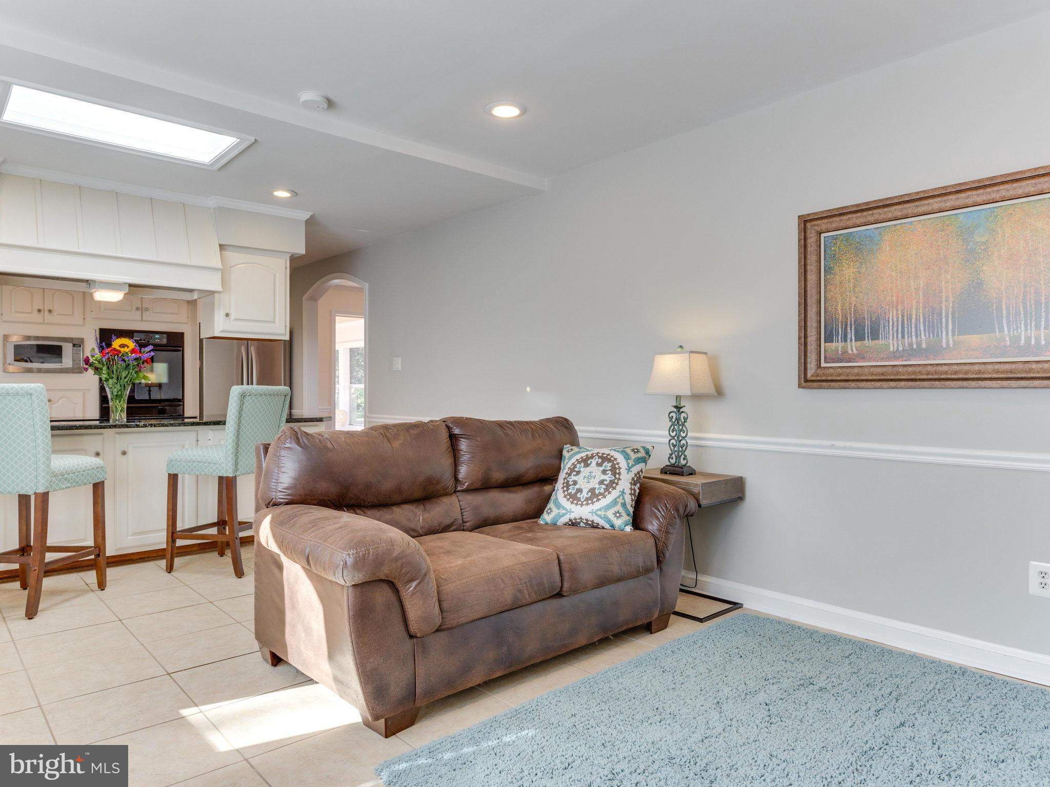 20473 Gleedsville Road Leesburg, VA 20175 - Photo 7 of 30 a living room with furniture and a lamp