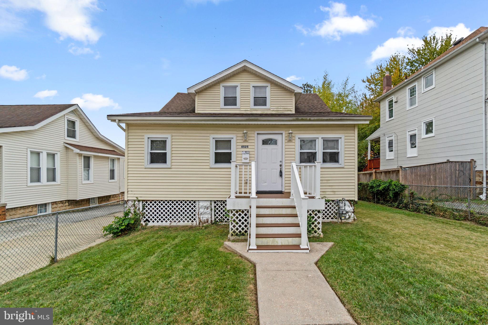 4525 Mainfield Avenue Baltimore, MD 21214 - Photo 1 of 33 a front view of a house with a yard