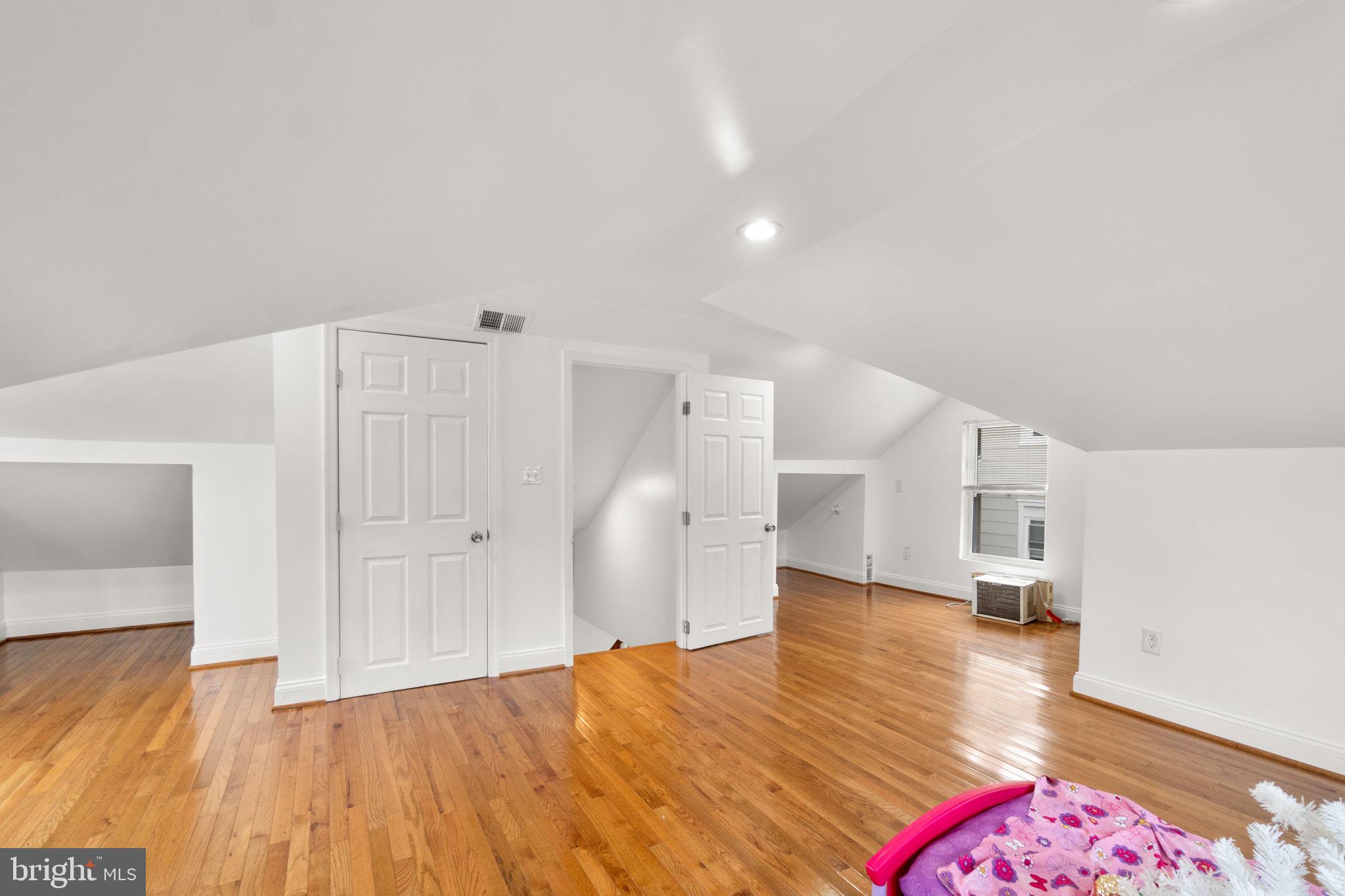 4525 Mainfield Avenue Baltimore, MD 21214 - Photo 16 of 33 a view of empty room with wooden floor