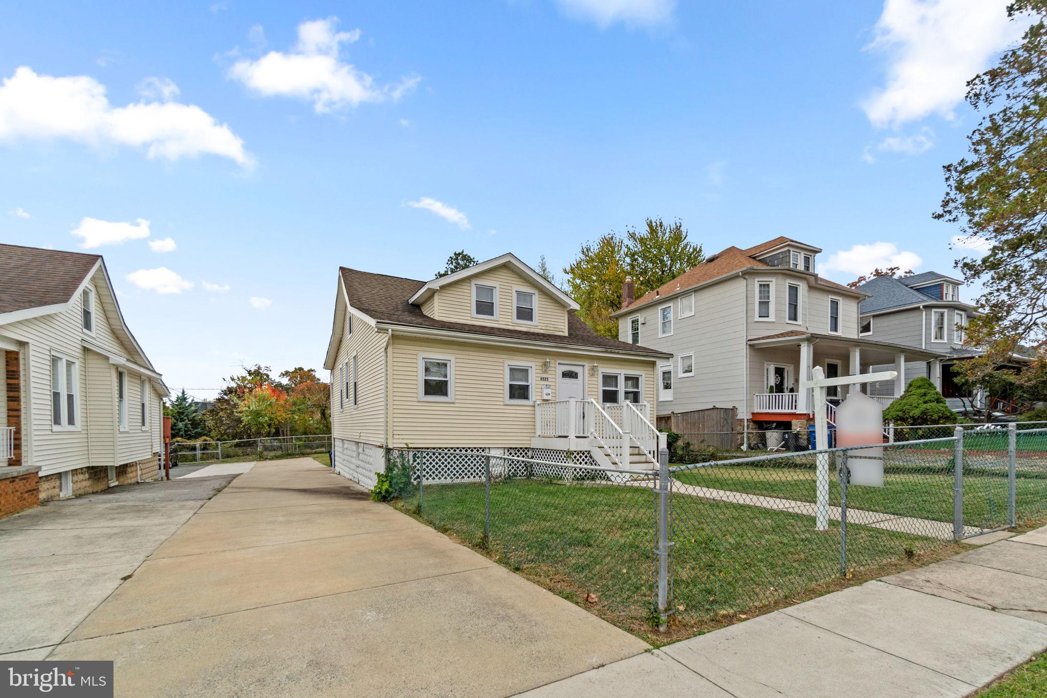 4525 Mainfield Avenue Baltimore, MD 21214 - Photo 30 of 33 a view of house with a yard and pathway