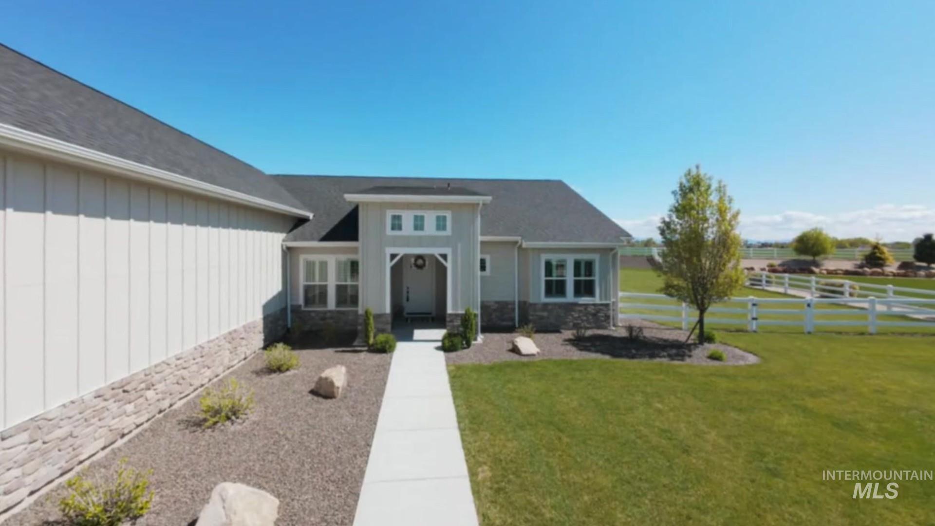 24696 Regal Road Middleton, ID 83644 - Photo 22 of 24 Modern ranch-style residence featuring a gray shingle roof and a light-colored board and batten facade