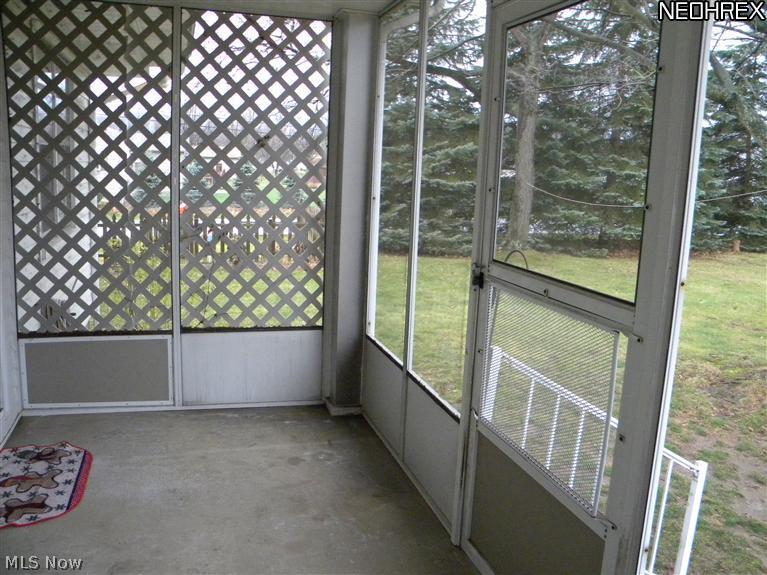 9745 Struthers Road New Middletown, OH 44442 - Photo 18 of 19 Back screened in porch off of kitchen
