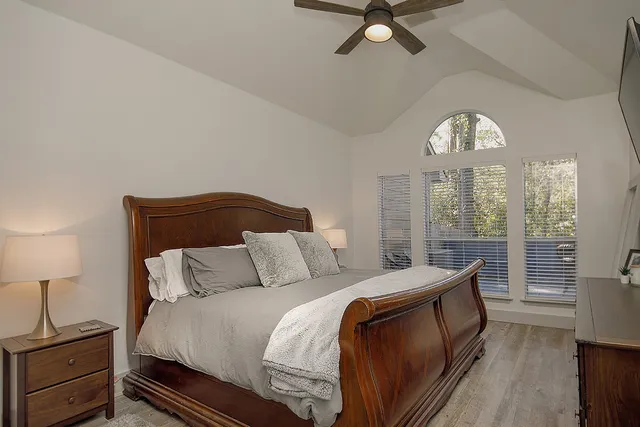 a bedroom with a bed and window