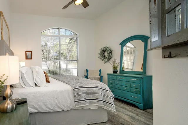 a bedroom with a bed and a dresser