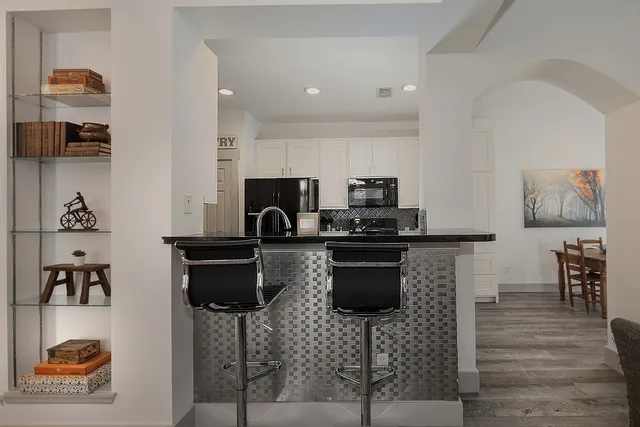 a kitchen with a sink cabinets and window