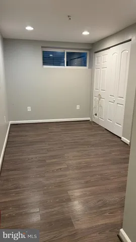 an empty room with wooden floor