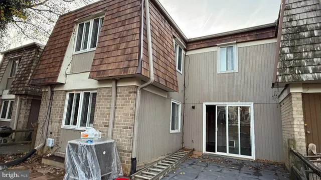 a view of houses with brick walls