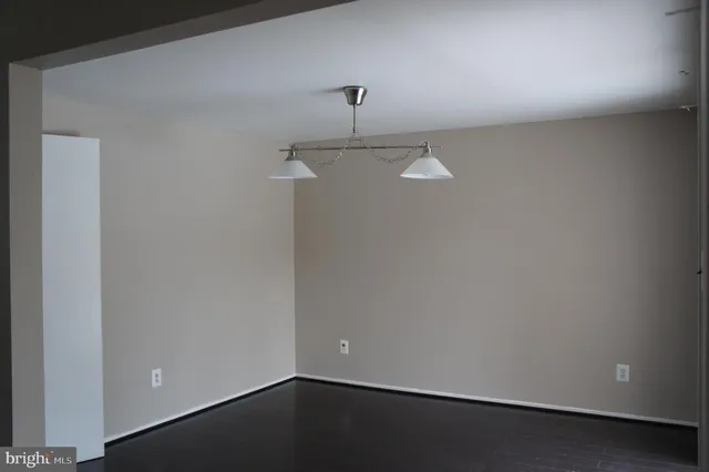 a view of a room with a ceiling fan