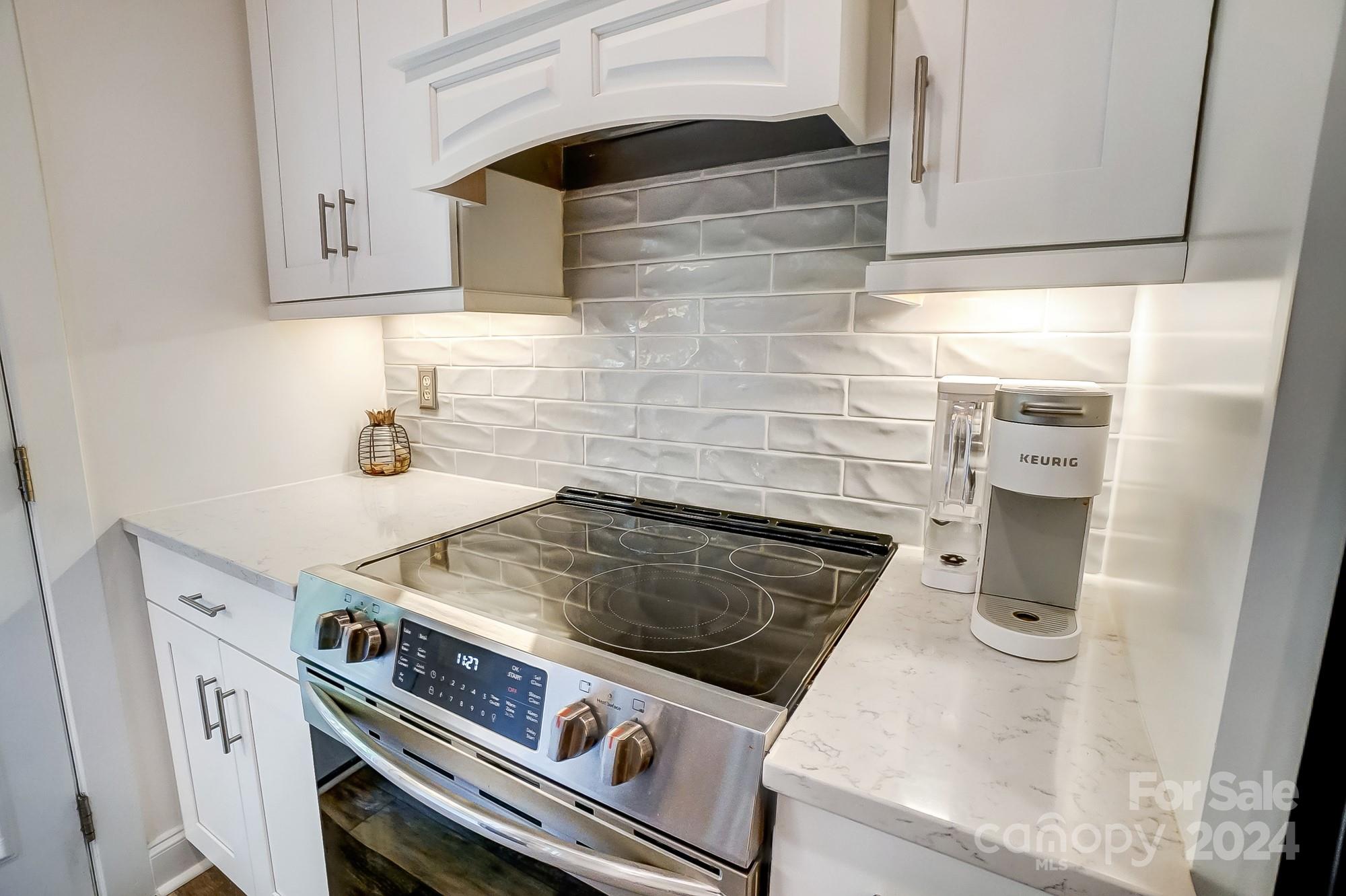 11343 Deer Ridge Lane Charlotte, NC 28277 - Photo 11 of 35 a stove top oven sitting inside of a kitchen