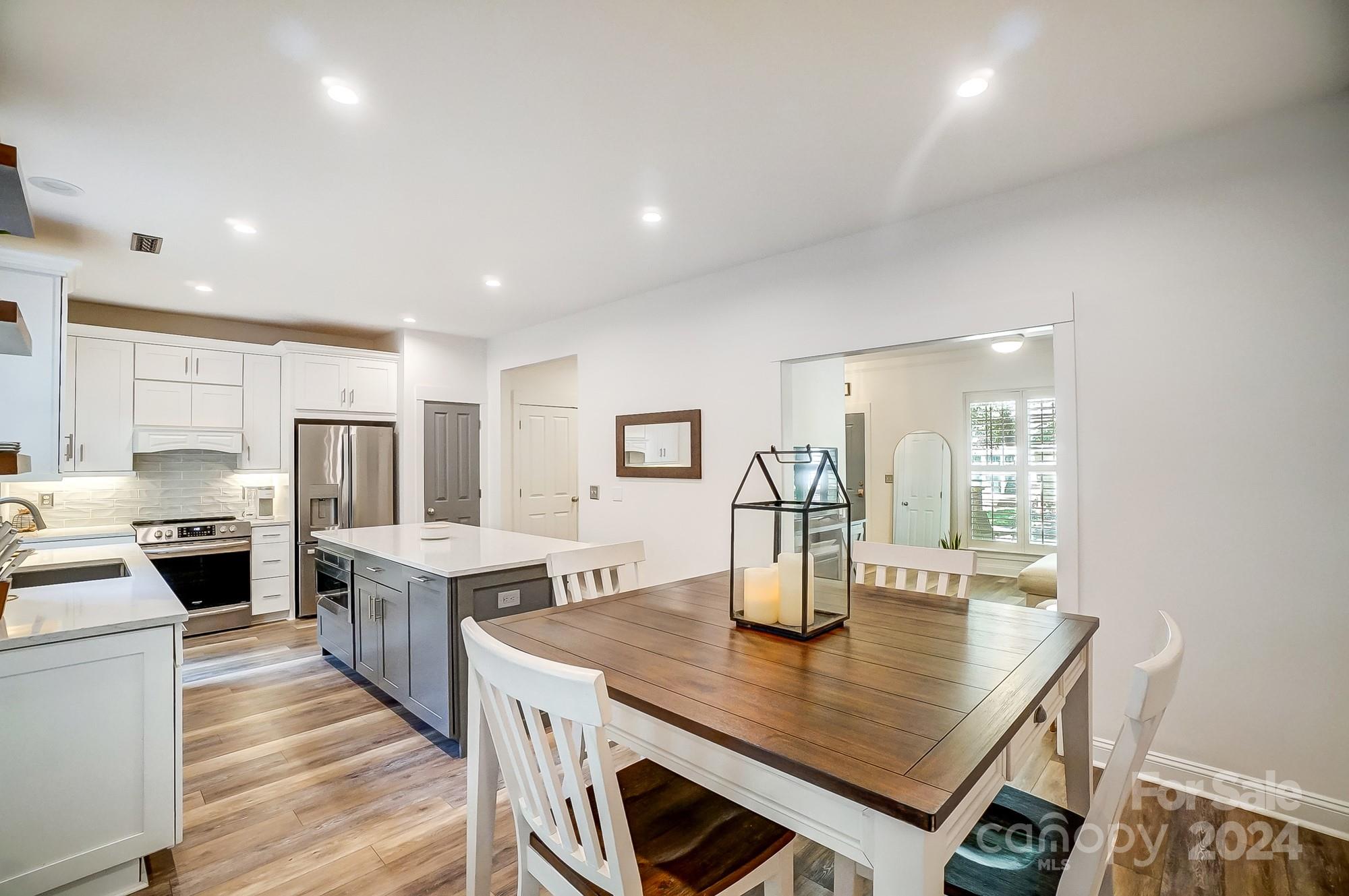 11343 Deer Ridge Lane Charlotte, NC 28277 - Photo 12 of 35 a large kitchen with a table and chairs