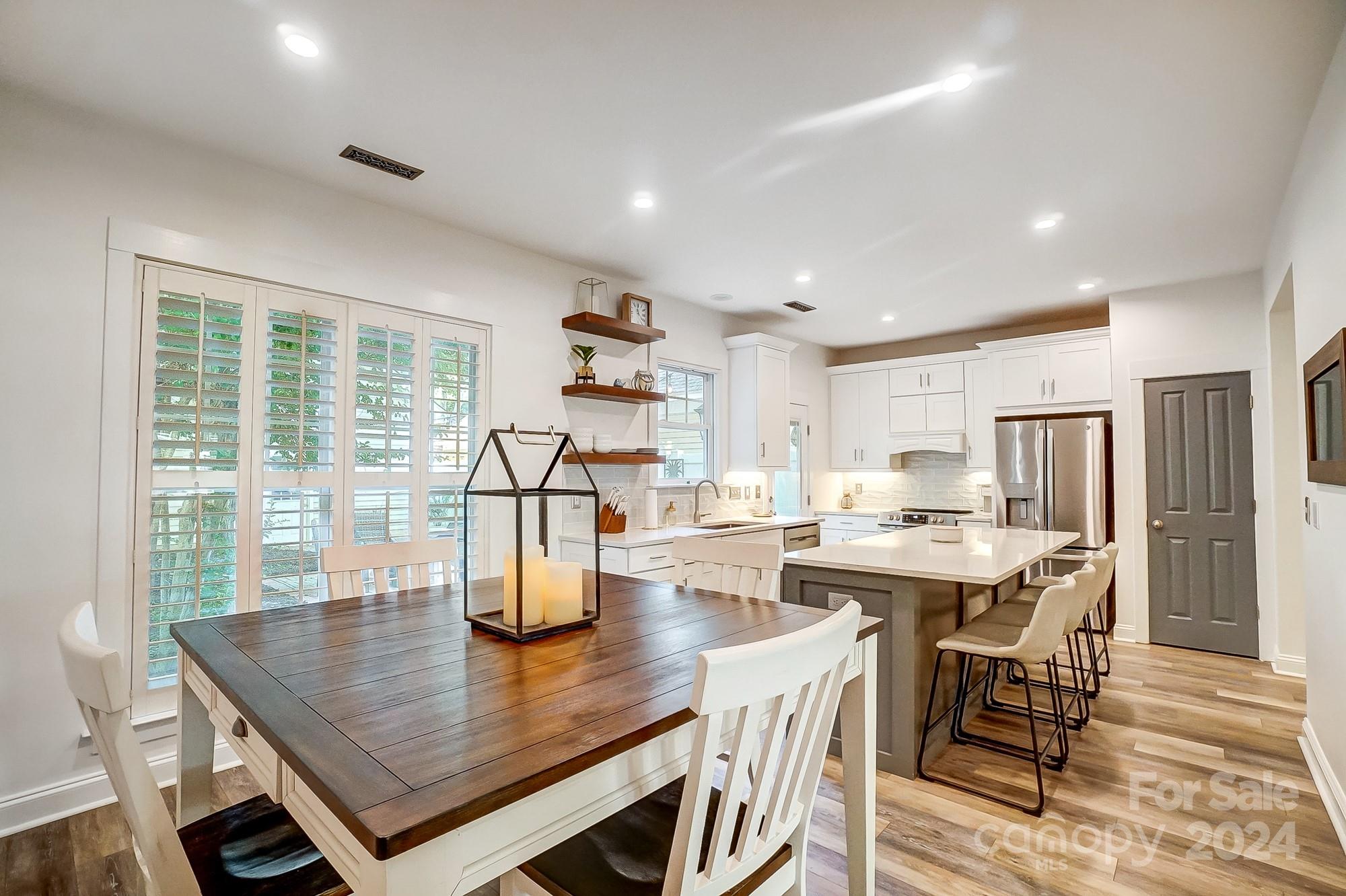 11343 Deer Ridge Lane Charlotte, NC 28277 - Photo 13 of 35 a view of a dining room with furniture and wooden floor