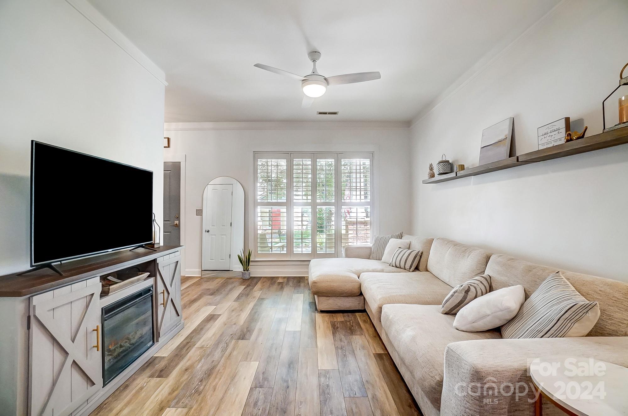 11343 Deer Ridge Lane Charlotte, NC 28277 - Photo 15 of 35 a living room with furniture and a flat screen tv