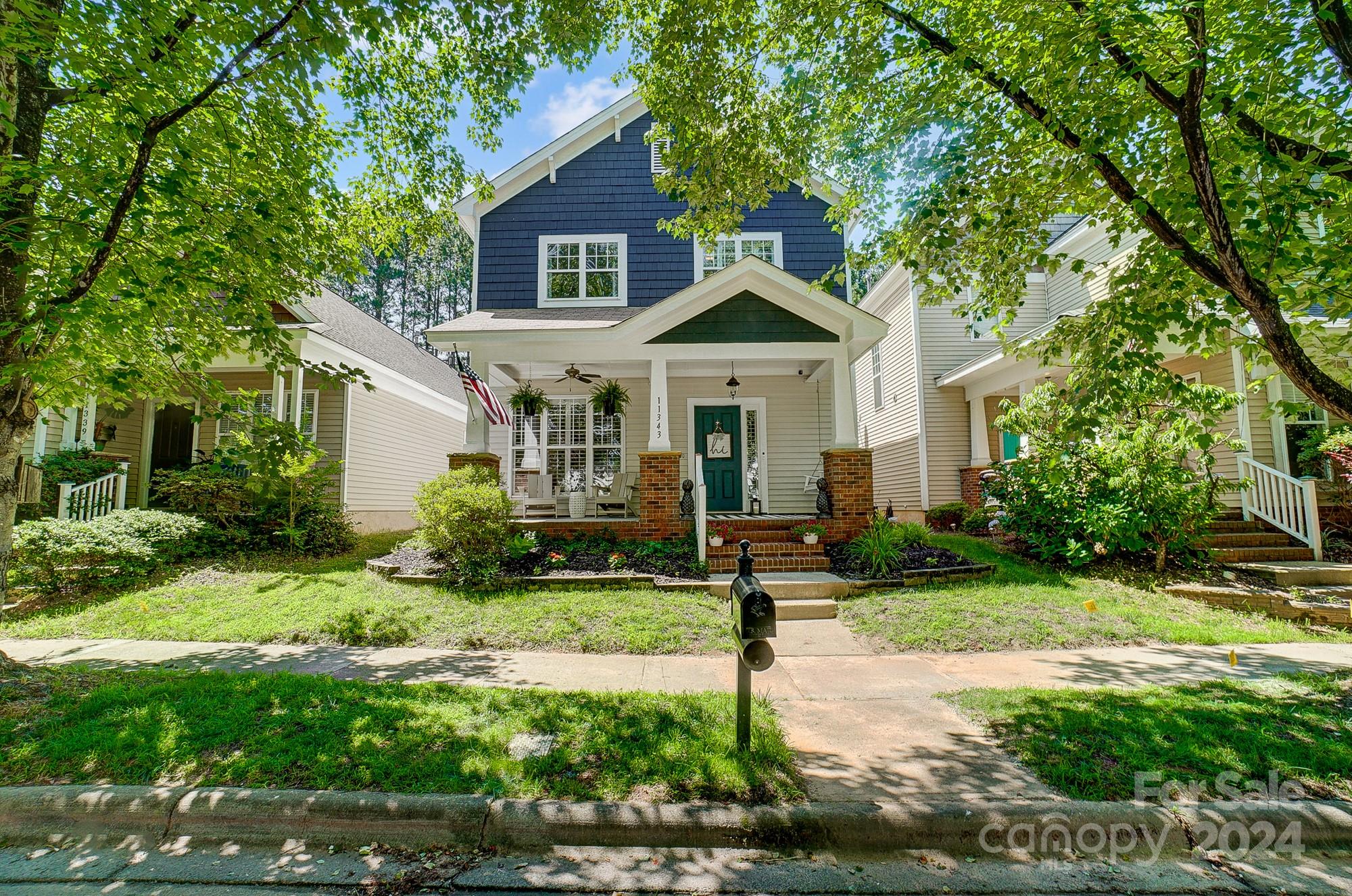 11343 Deer Ridge Lane Charlotte, NC 28277 - Photo 2 of 35 a front view of a house with a yard and porch