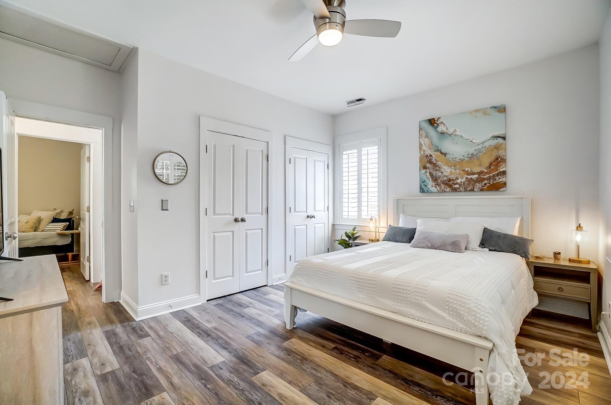 11343 Deer Ridge Lane Charlotte, NC 28277 - Photo 21 of 35 a bedroom with a bed and a chandelier