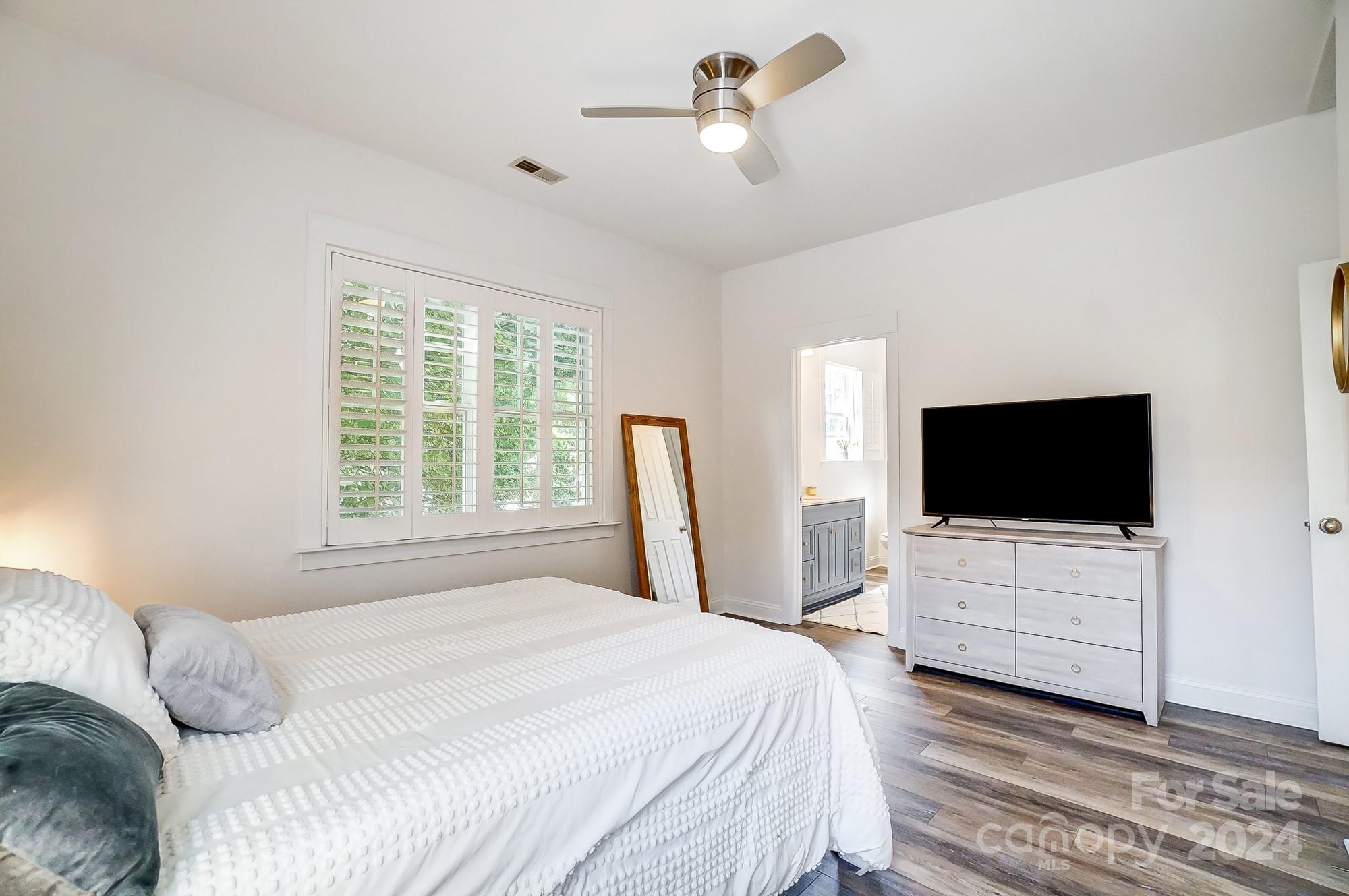 11343 Deer Ridge Lane Charlotte, NC 28277 - Photo 22 of 35 a bedroom with a bed and a flat screen tv
