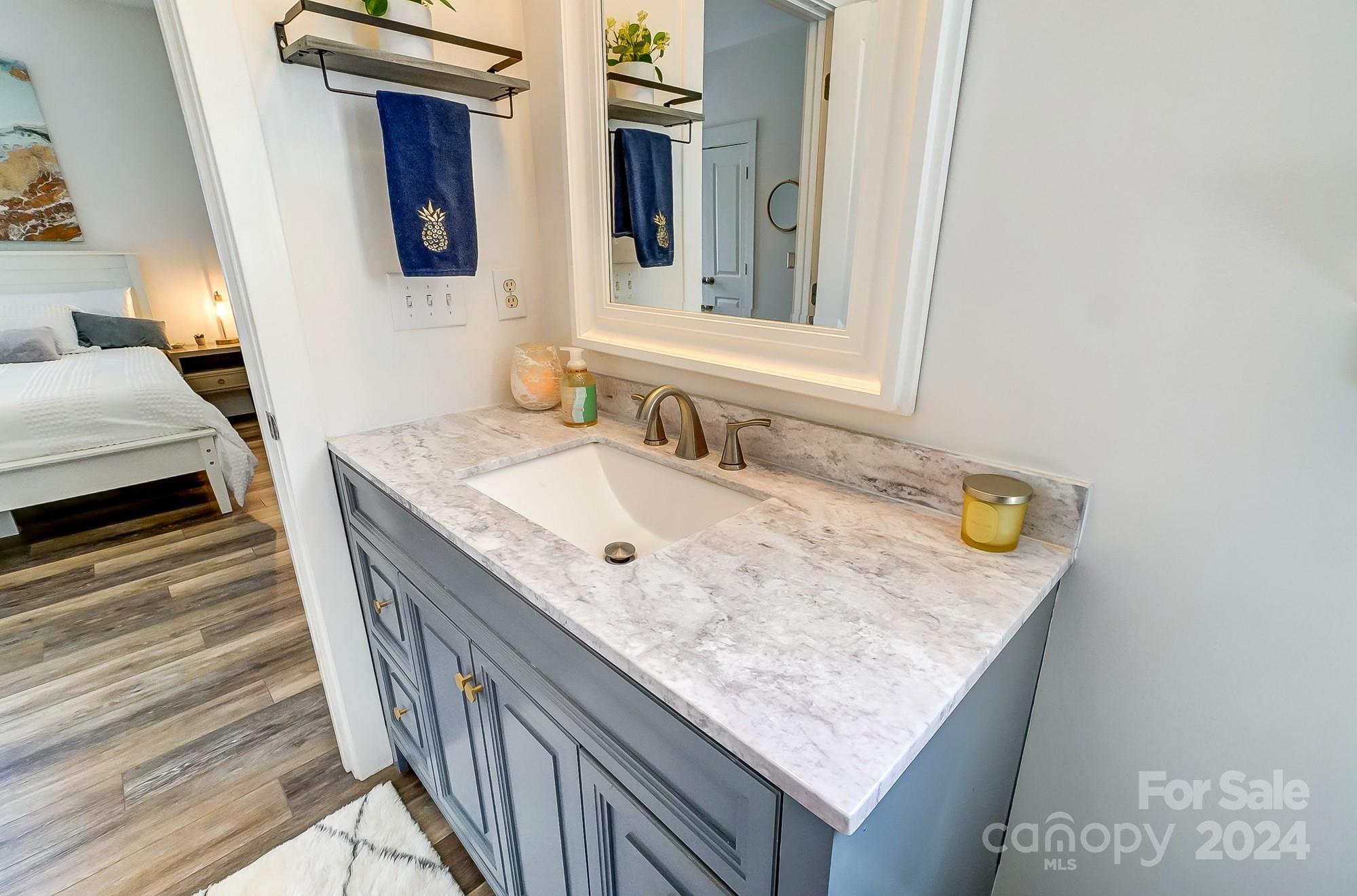 11343 Deer Ridge Lane Charlotte, NC 28277 - Photo 25 of 35 a bathroom with a granite countertop sink and a mirror