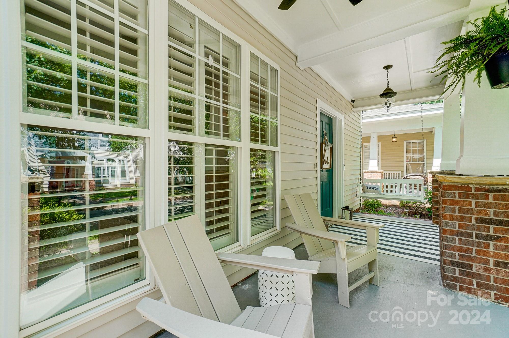 11343 Deer Ridge Lane Charlotte, NC 28277 - Photo 4 of 35 a view of a balcony with two chairs and a potted plant