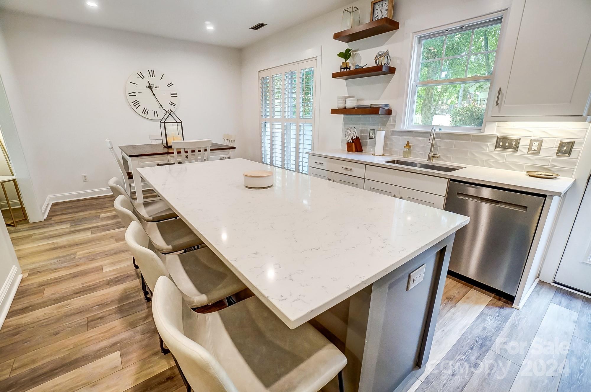 11343 Deer Ridge Lane Charlotte, NC 28277 - Photo 9 of 35 a kitchen with a stove a sink and a refrigerator