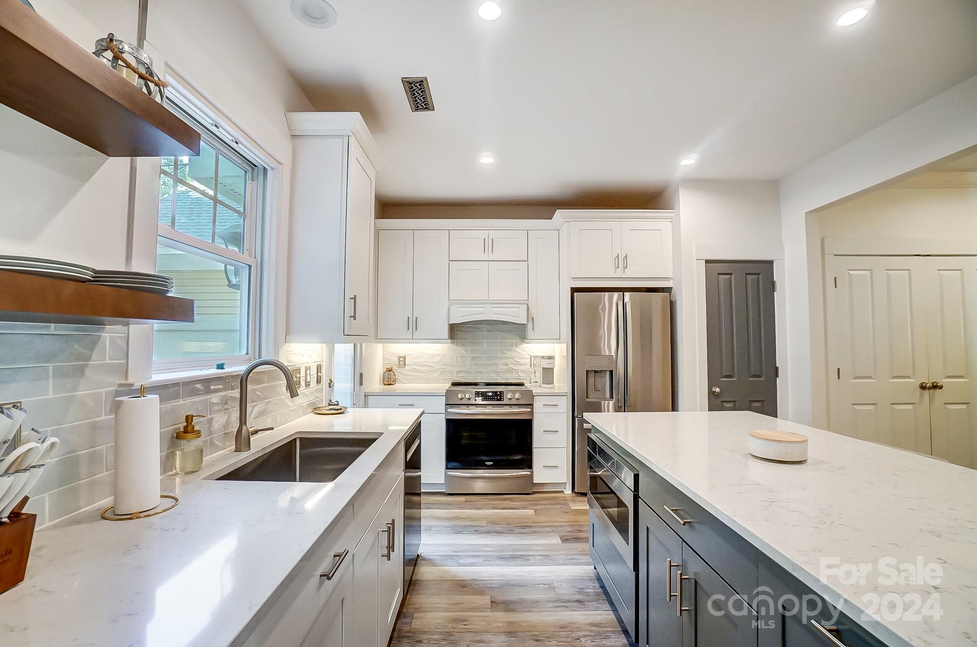 11343 Deer Ridge Lane Charlotte, NC 28277 - Photo 10 of 35 a kitchen with stainless steel appliances granite countertop a sink stove and refrigerator