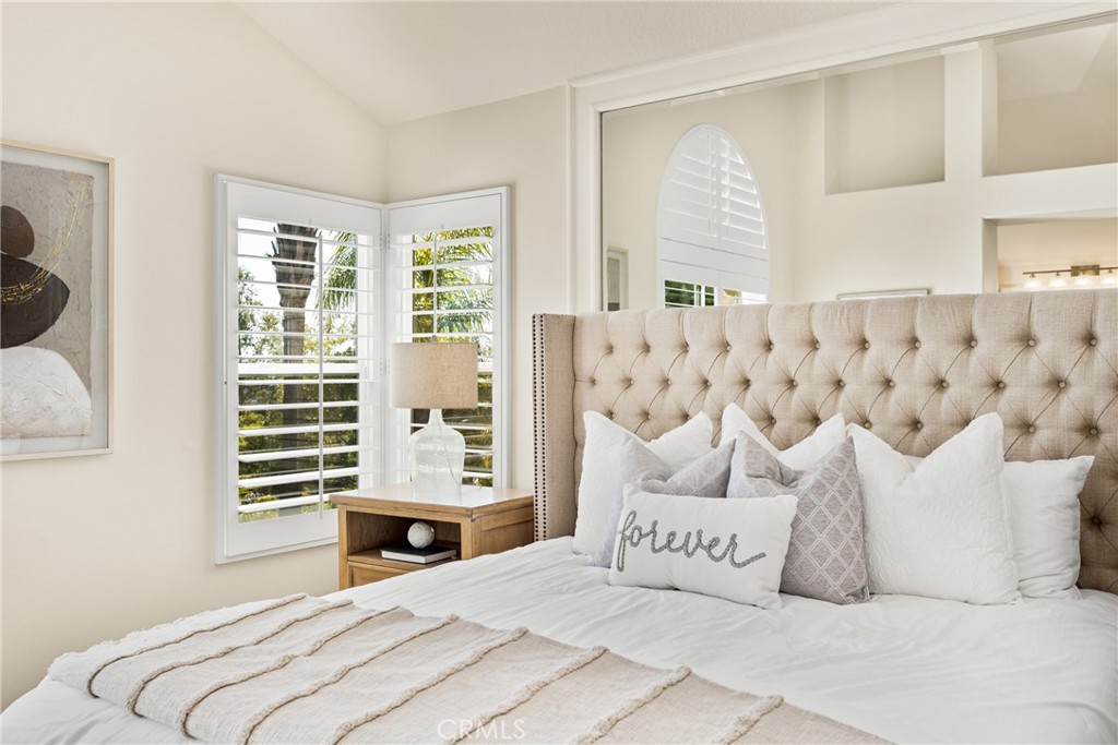 36 Mallorca Lake Forest, CA 92610 - Photo 37 of 64 a bedroom with a bed and a window