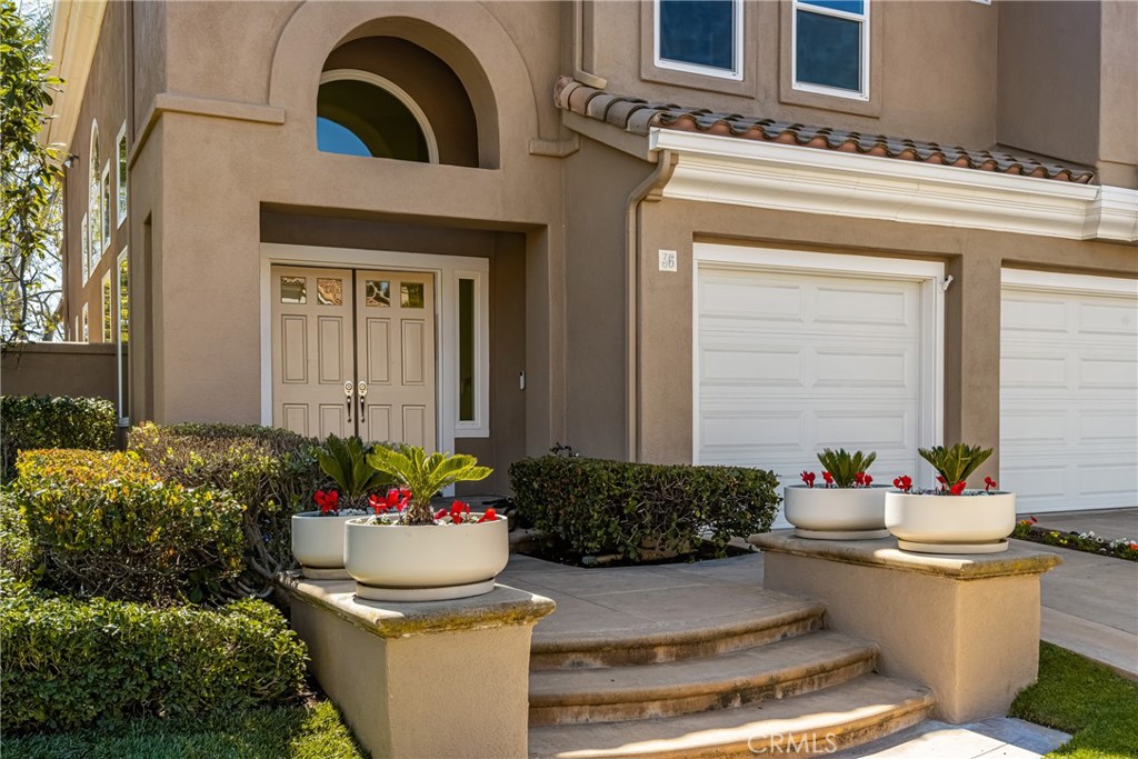 36 Mallorca Lake Forest, CA 92610 - Photo 4 of 64 a front view of a house with a fountain