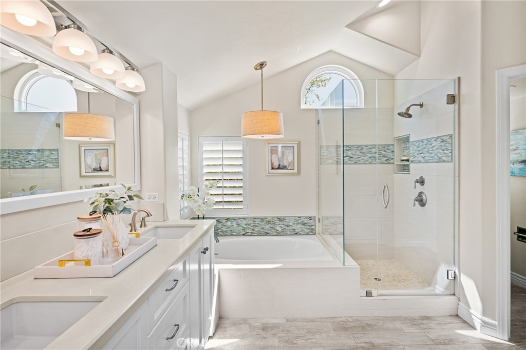 36 Mallorca Lake Forest, CA 92610 - Photo 41 of 64 a bathroom with a tub sink and mirror