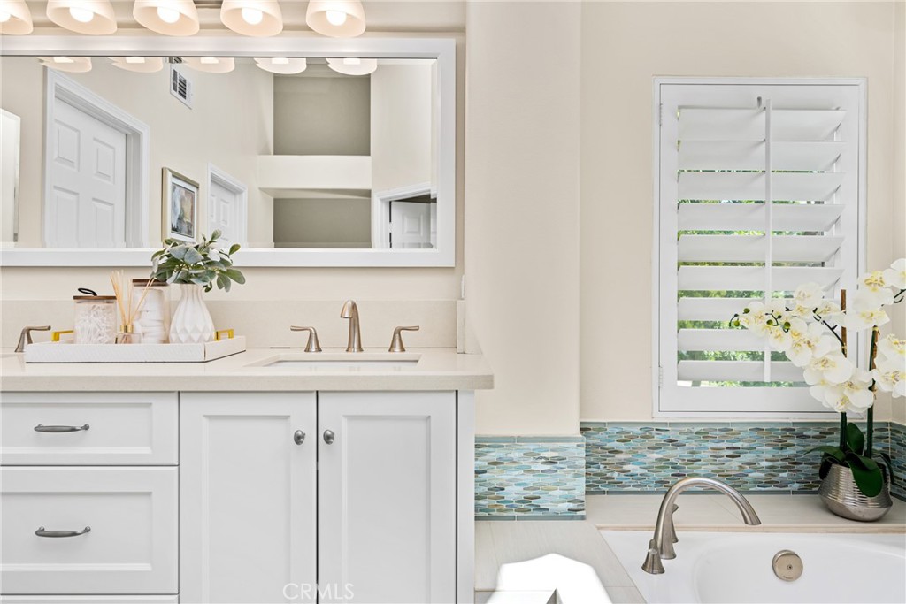 36 Mallorca Lake Forest, CA 92610 - Photo 43 of 64 a bathroom with a sink and a mirror