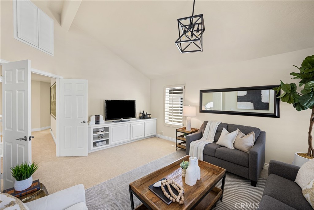 36 Mallorca Lake Forest, CA 92610 - Photo 46 of 64 a living room with furniture and a flat screen tv