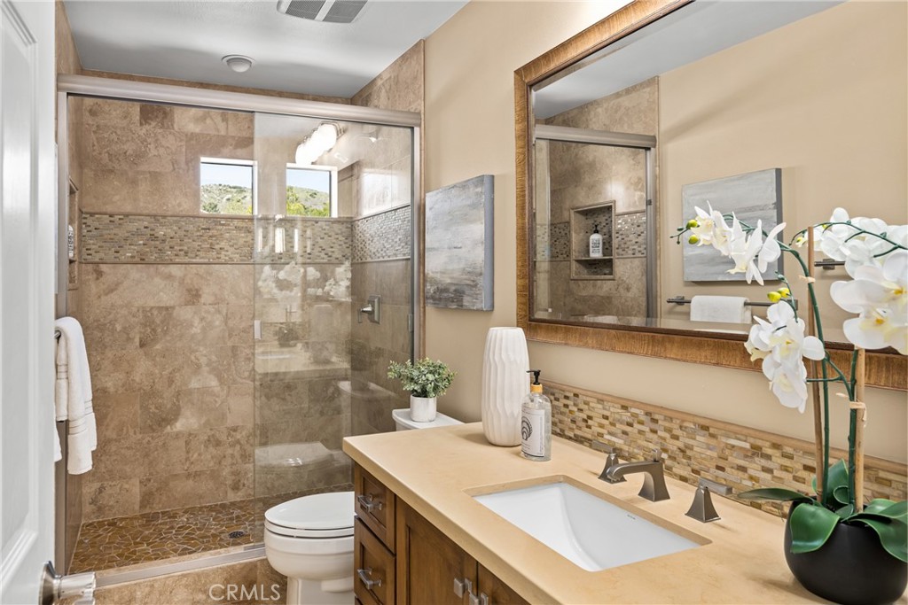 36 Mallorca Lake Forest, CA 92610 - Photo 47 of 64 a bathroom with a sink toilet and shower