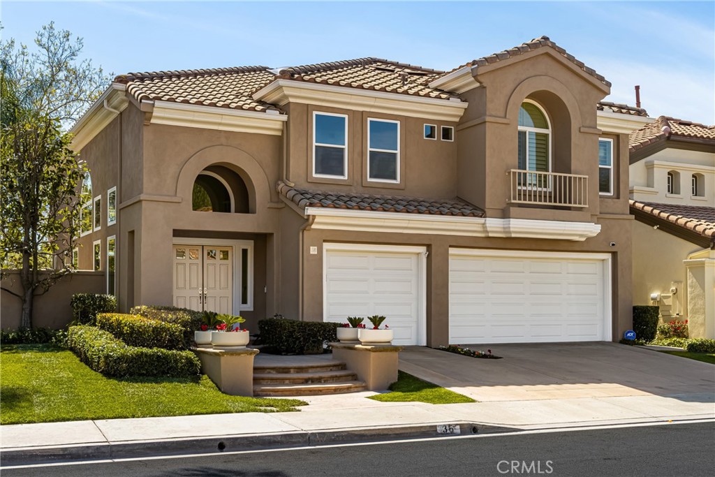 36 Mallorca Lake Forest, CA 92610 - Photo 63 of 64 a front view of a house with garden