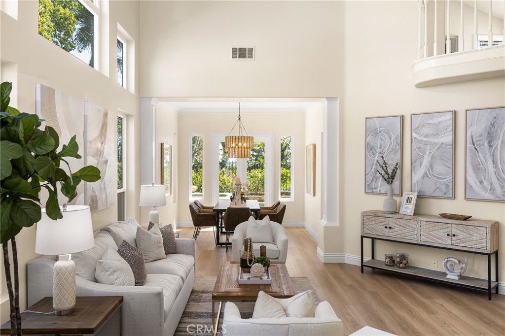 36 Mallorca Lake Forest, CA 92610 - Photo 7 of 64 a living room with furniture and a large window