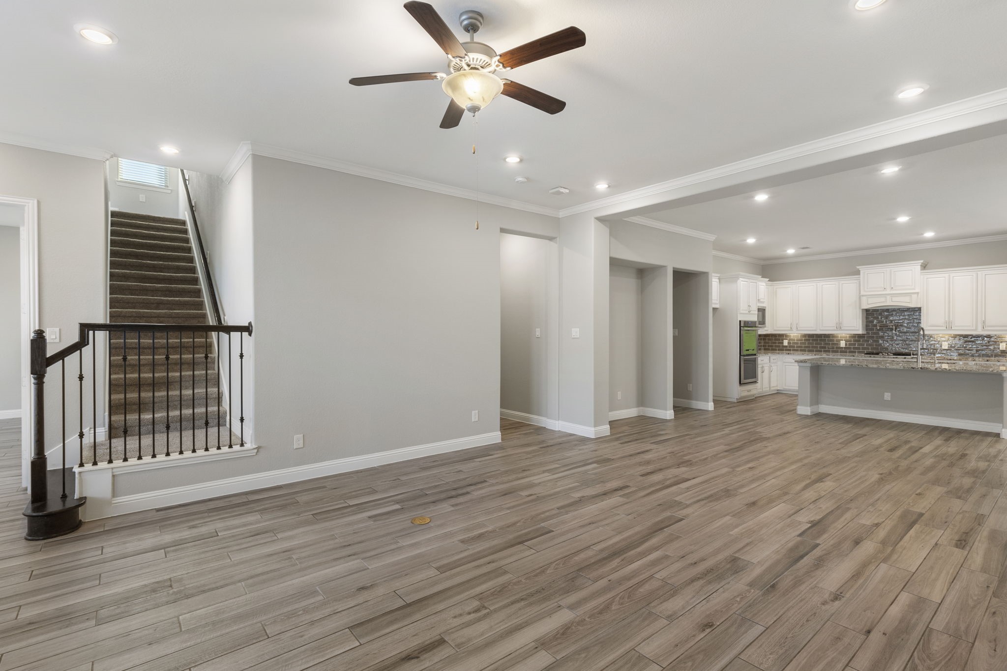 18855 Collins View Drive New Caney, TX 77357 - Photo 21 of 50 an empty room with wooden floor and windows