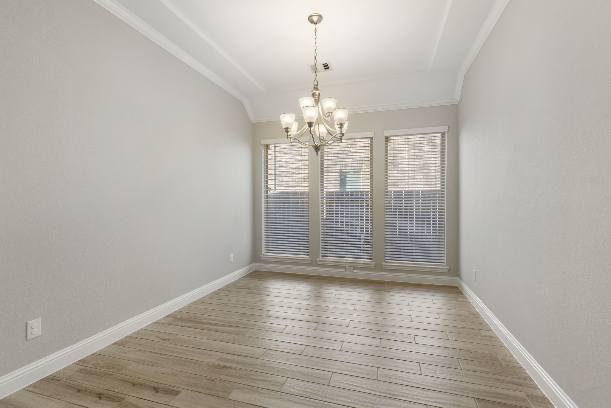 18855 Collins View Drive New Caney, TX 77357 - Photo 27 of 50 a view of wooden floor and chandelier in living room
