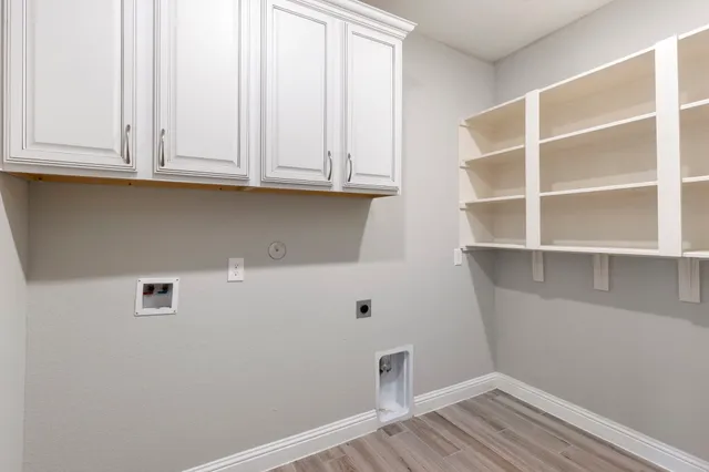 a view of cabinets and wooden floor