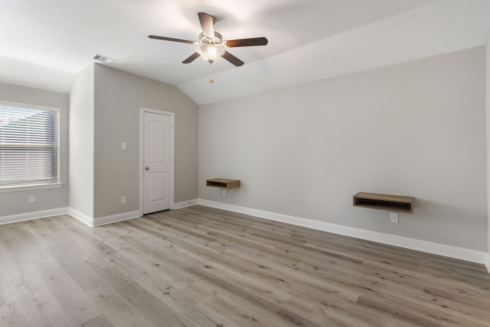 18855 Collins View Drive New Caney, TX 77357 - Photo 35 of 50 an empty room with wooden floor and windows