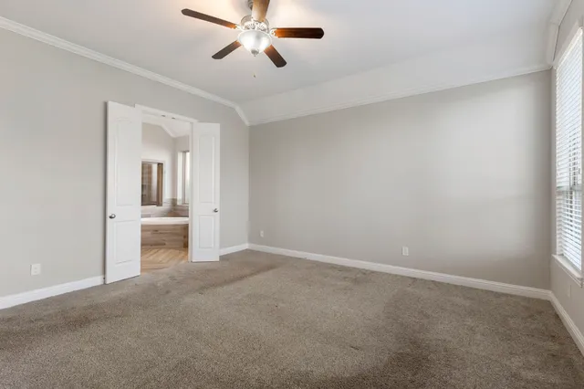a view of a room and a bathroom