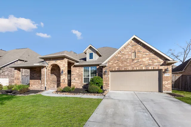 a front view of a house with yard